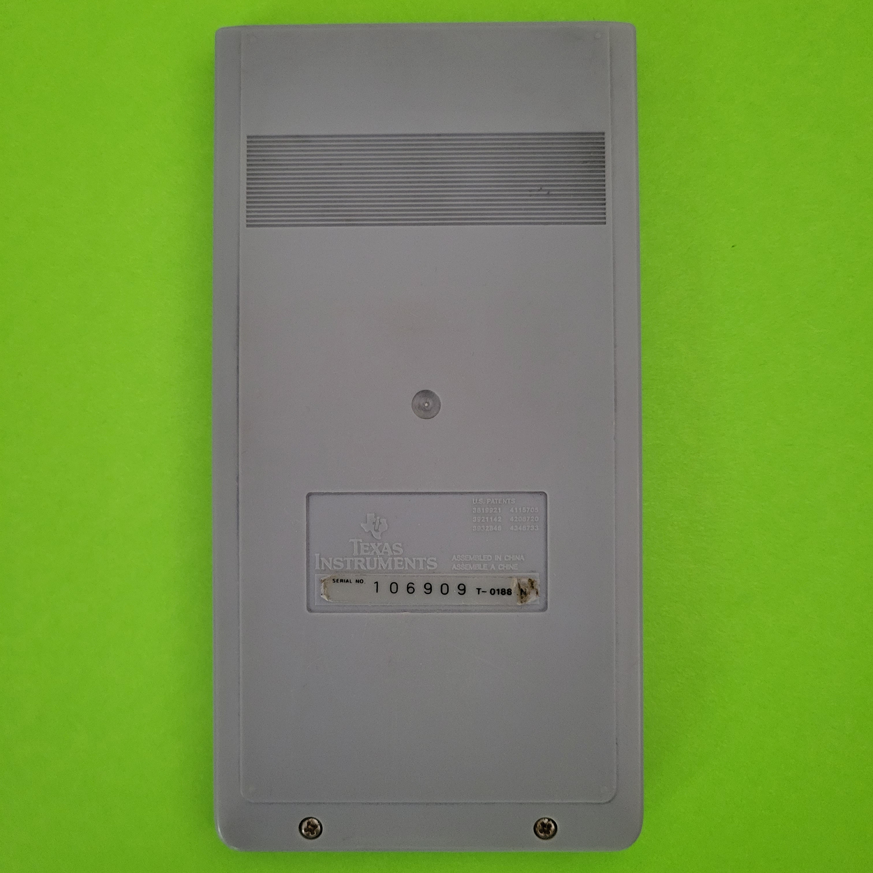 An image of the back of a texas instruments ti35 SLR scientific/engineering calculator